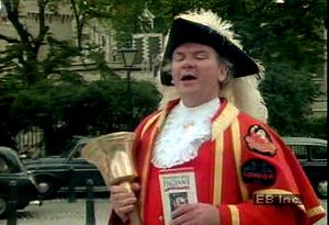 Listen to a town crier welcome passersby outside the Tower of London and Tower Hill Pageant