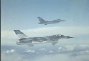See two F-16 Fighting Falcons flying in formation